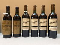 Six bottles standing, two Domaine De La Magnanerie 1991 and four Aramis 2000