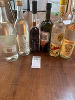Front view of all six sealed bottles on tabletop