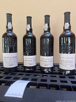 Four bottles Taylor Fladgate Vintage Port front view
