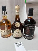 Front view of all three sealed bottles with labels visible