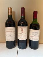 Front view of all three wine bottles showing labels and capsules