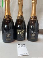 Front view of three Trius Brut sparkling wine bottles