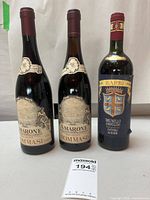 Front view of all three wine bottles showing labels and capsules