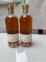 Front view two sealed Harris Beach Rye Fifty-One whisky bottles