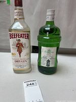Front view of Beefeater and Tanqueray bottles