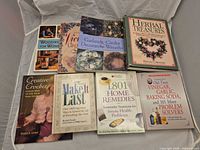 All eight books laid out front covers visible