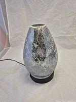 Full view of diffuser on base showing crackle mosaic finish
