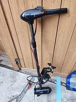 Full view of trolling motor showing head, shaft, and mount