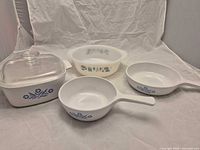 Group shot of all four CorningWare pieces showing patterns and lid