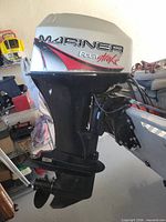 Full port-side view of Mercury Mariner FourStroke outboard mounted on transom