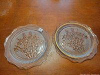 Both Iris & Herringbone plates side by side, showing pattern and gold rim on one