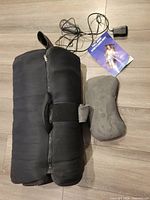 Rolled Belmint massage mat with head pillow, power adapter and manual