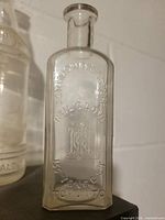 Front view showing full embossing text and monogram