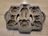 Front view showing six teddy bear cavities and handles