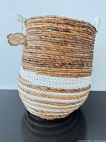 Front view of woven basket with tag