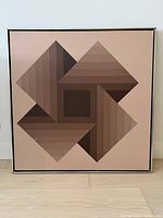 Front view of framed geometric painting showing full design and frame