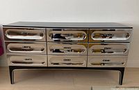 Front view of dresser with nine chrome drawers