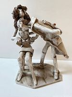 Front view of signed Dino Banzini doctor and patient ceramic sculpture