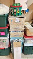 stack of storage totes, three-drawer organizer, metal nutcracker tin