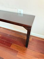 Close view of leg and top surface, finish detail