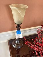 Full view of lamp showing base and shade