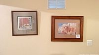 Wall view showing both framed prints side by side