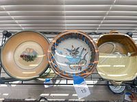 Front view showing three bowls on rack