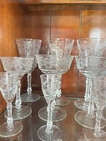 Group shot of all nine etched glass stemware pieces