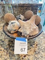 Bowl with shells, rattan balls and trinkets overview
