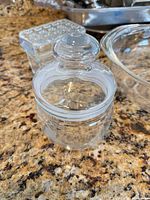 round glass jar with lid in foreground