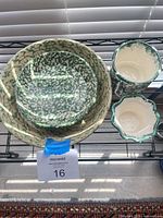 Group shot of all four spongeware ceramic pieces on shelf