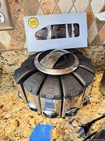 Rotating spice rack and boxed Thermo pen on countertop