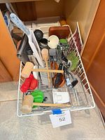 Overall view of utensils in wire basket