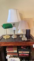 All four lamps grouped on tabletop