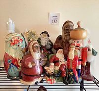 Group shot of all figurines and nutcrackers on shelf