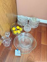 Group shot of all bowls, stemware and glass sphere