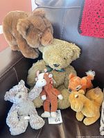 Group of plush toys on chair