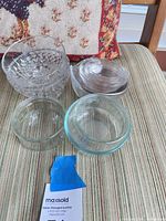 Group view of all bowls on chair seat