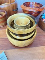Stacked nested bowls showing wood grain and accent ring