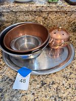All five metal and copper pieces together on the tray