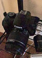 Canon DSLR with attached 18-55mm lens