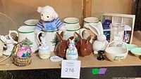 Overall view showing Spode mugs, brown rabbits, white rabbit, baskets, shakers