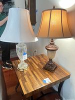 Both table lamps on side table showing overall appearance and shades