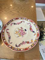 Multicolour floral saucer with red and gold border