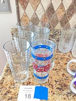 Group view showing Pepsi-Cola glass and several clear textured tumblers