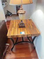 Full view of end table with lamp on top