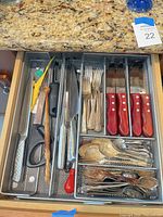 Top view of entire drawer organizer showing knives, shears, forks, spoons