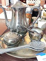 Group view of entire silver-plate set on tray