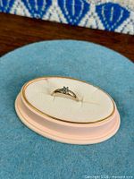 Ring in display case front view