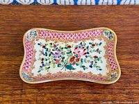 Top view of Limoges porcelain tray showing floral design and gilt rim